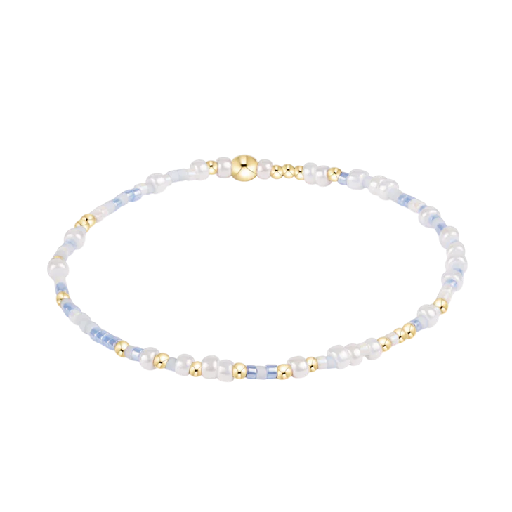 Delicate bracelet with small beads on a white background