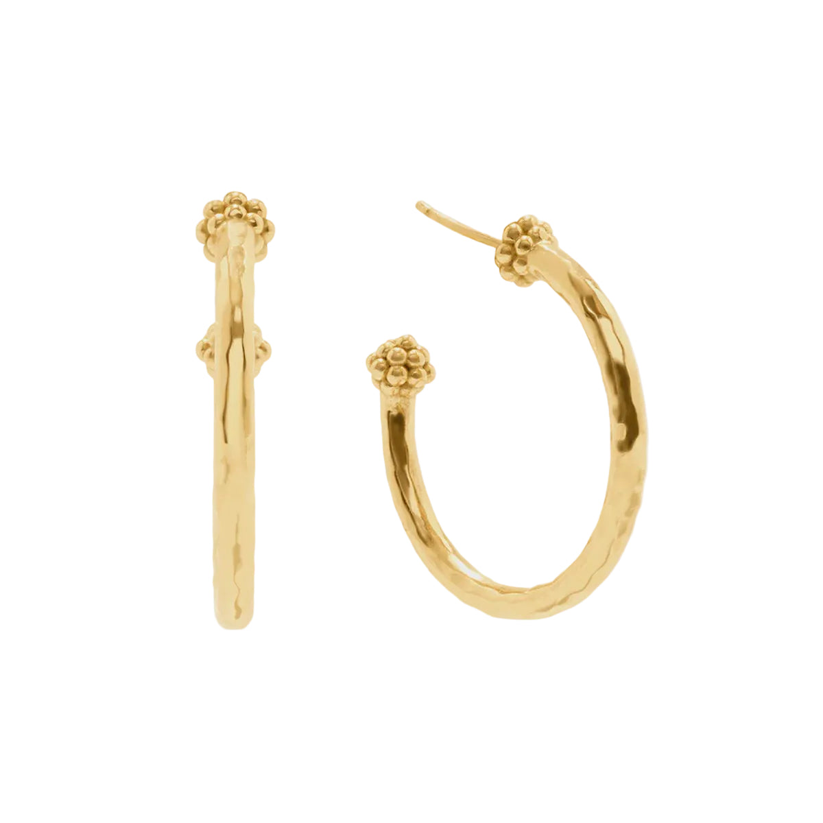 A pair of gold hoop earrings with textured, hammered finishes and decorative floral clusters at the top, shown on a light gray background.