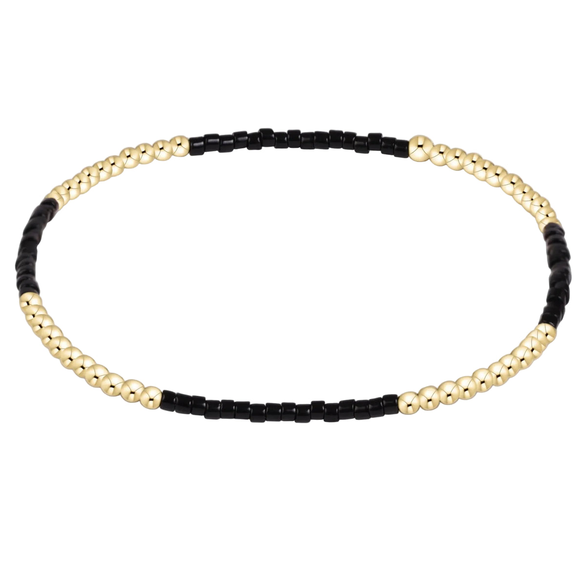A beaded stretch bracelet featuring alternating sections of polished gold-tone round beads and matte black cylindrical beads, displayed on a clean white background.