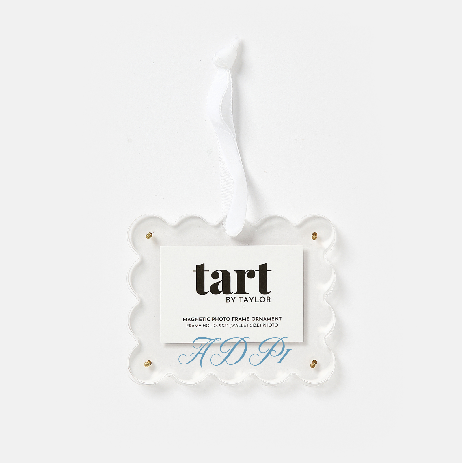 A clear scalloped acrylic hanging ornament with a white paper insert card that reads 'tart BY TAYLOR' and 'MAGNETIC PHOTO FRAME ORNAMENT,' shown on a light gray background.