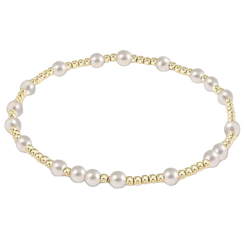 Pearl bracelet with gold accents on a white background