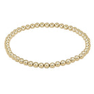 Gold beaded bracelet on a light gray background