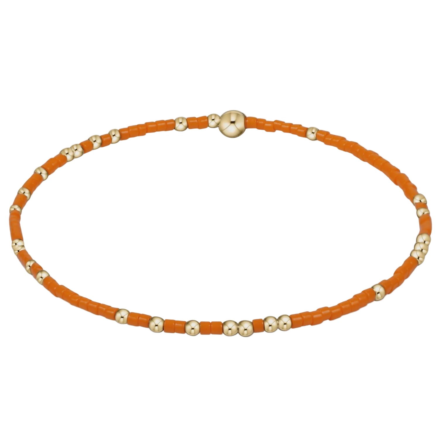 Necklace with orange beads and gold accents on a light gray background