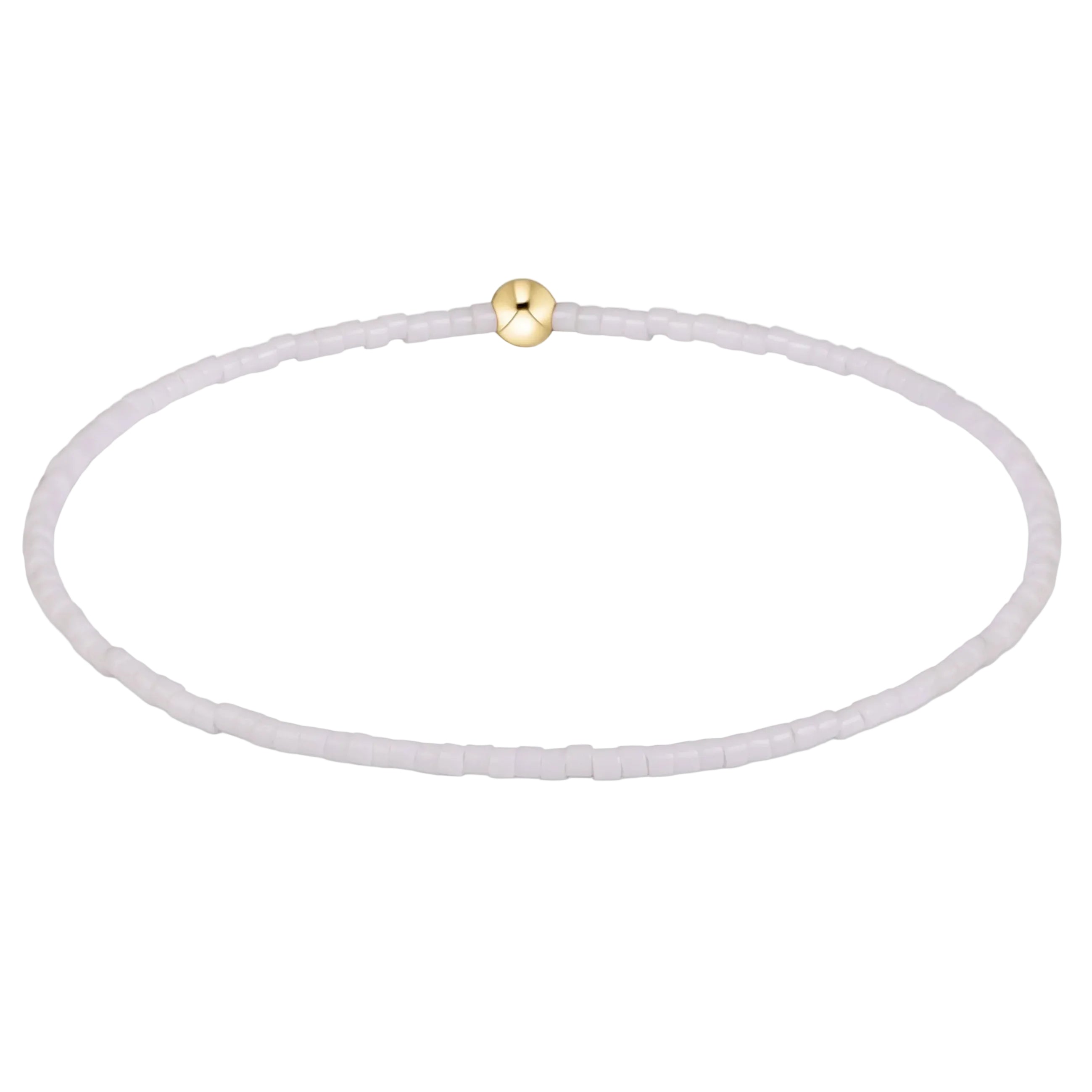 A delicate beaded bracelet with small, translucent pale lavender beads and a single polished gold clasp, shown on a clean white background.